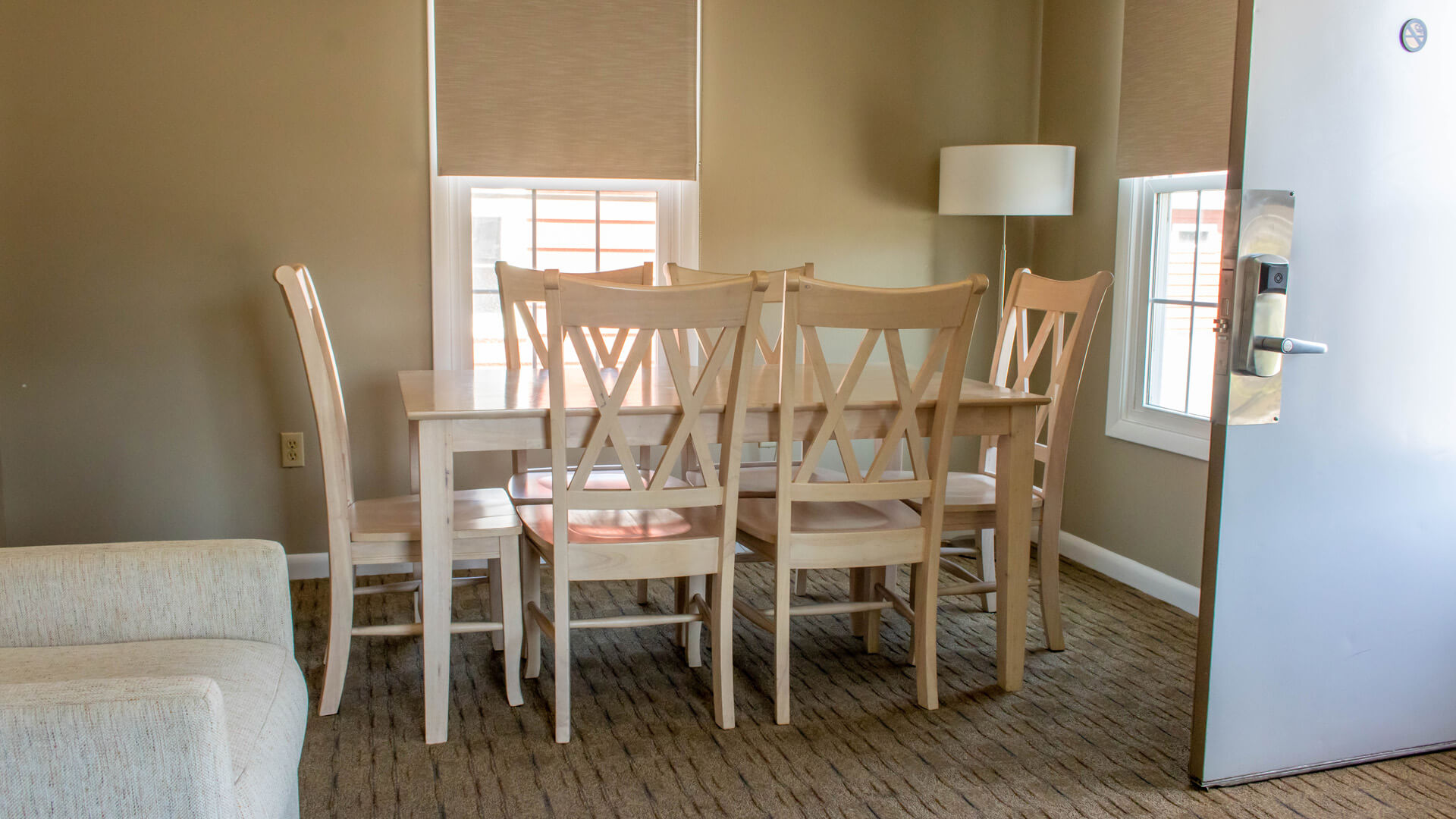 Vacation Homes 600-613 room with dining table and chairs